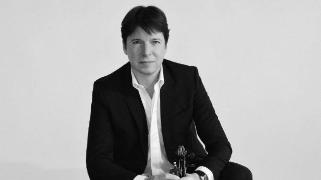 black and white image of Joshua Bell looking into camera